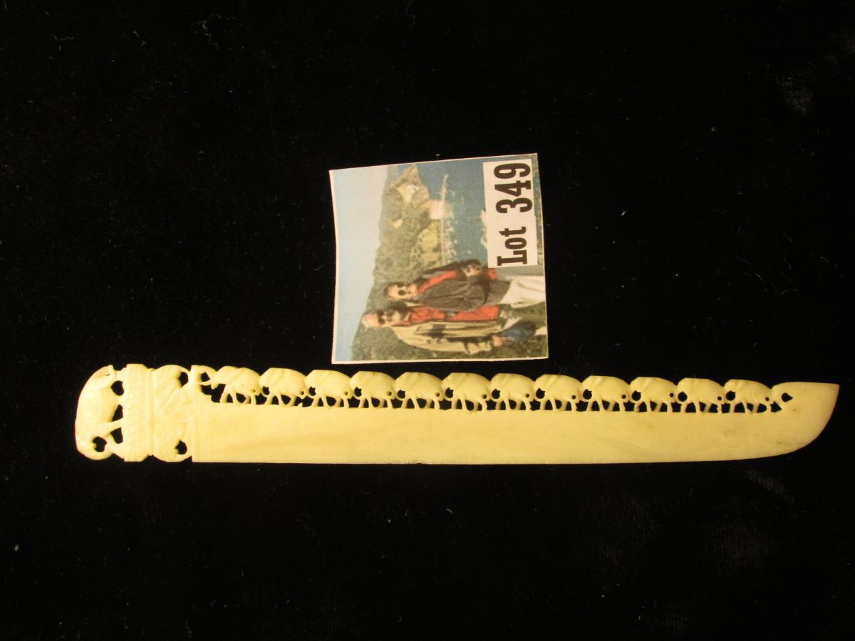 Ivory Letter Opener with Elephants following elephants ornate carvings. 7".