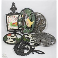 BOX OF 7 VARIOUS VINTAGE CAST IRON TRIVETS