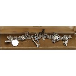 STERLING SILVER CHARM BRACELET IN WOODWARDS BOX