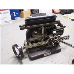 Graphotype Dog Tag Embosser With a Dominion Meat Grinder