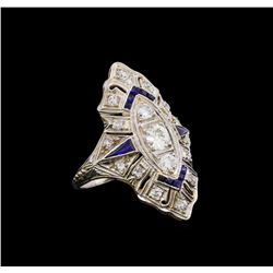 0.73 ctw Diamond and Sapphire Ring - Platinum