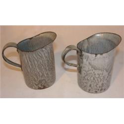 Pair of agateware cream pitchers