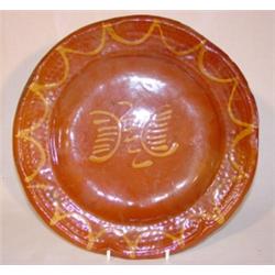 Slip decorated redware plate