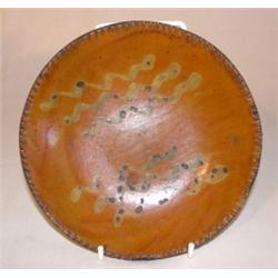 Diminutive slip decorated redware dish