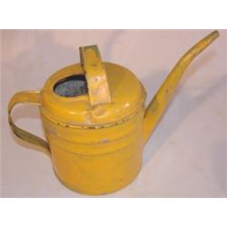 Yellow painted tin oil can