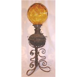 Very ornate Victorian lamp with amber shade