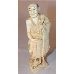 Carved ivory Oriental fisherman
