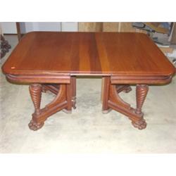 Ornate Victorian dining table with claw feet