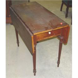 Primitive one drawer table with drop leaves