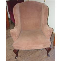 Queen Anne style wing chair with stretcher base