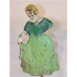 Figural cast-iron door stop of Victorian lady