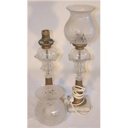 Pair of clear glass whale oil lamps with frosted shades
