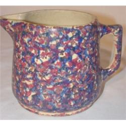 Blue and purple sponge decorated handled pitcher