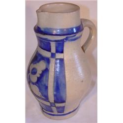 Contemporary blue decorated stoneware handled pitcher