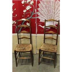 TWO ANTIQUE LADDER BACK CHAIRS WITH RUSH SEATS