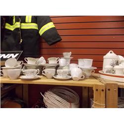 TEA CUPS AND SAUCERS