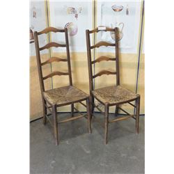 TWO ANTIQUE LADDER BACK CHAIRS WITH RUSH SEATS