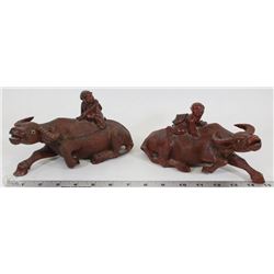 PAIR OF VINTAGE HAND CARVED WOOD BULLS WITH GLASS