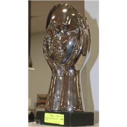 CHROME COLORED DECORATIVE STATUE