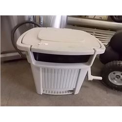 GARDEN HOSE WINDING HOLDER IN ENCLOSED CONTAINER WITH LID