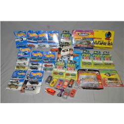 Selection of die cast cars and trucks, mostly in original packaging including Hot Wheels and Phat Bo