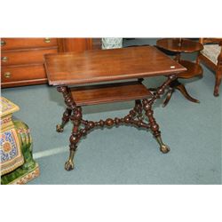 Antique library table with heavy turned stretcher and supports, and large cast and wood ball and cla