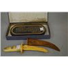 Image 1 : Oval gilt "Poem of Scholar" dark ink block, purportedly 19th century and a bone knife and scabbard