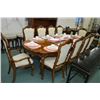 Image 1 : Quality oak dining room table with two skirted insert leafs and ten dining chairs with carved backs 