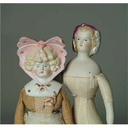 14" STONE BISQUE SHOULDER HEAD WITH ELABORATE BUTTERFLY BONNET ALONG WITH A 1959 ARTIST PARIAN WITH 