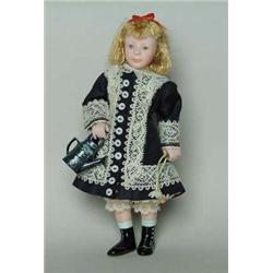 4" RENOIR GIRL BY EUNICE TUTTLE. Jointed all bisque artist doll of a girl in a navy dress holding a 