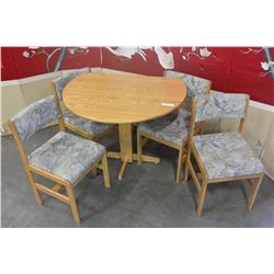 ROUND OAK DROPLEAF DINING TABLE AND FOUR CHAIRS