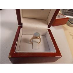 RING -STAMPED 14KH YELLOW GOLD WITH ROUND FACETTED OPAL- FROM ESTATE