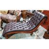 Image 1 : LEATHER AND CARVED WOOD CHAISE