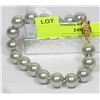 Image 1 : #10- SEA SHELL PEARL BRACELET 7.5" GREY