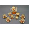 Image 1 : A Clarice Cliff 'Autumn Crocus' pattern part coffee service, comprising:- five coffee cans and sa...