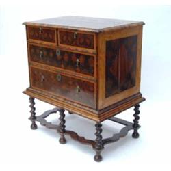 A William & Mary walnut chest on stand, circa 1685, oyster-veneered and holly banded, the moulded...