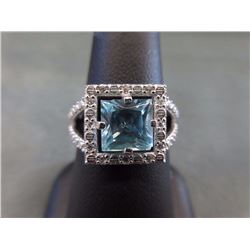 RING - PRINCESS FACETED LIVELY BLUE TOPAZ IN STERLING SILVER SETTING - RETAIL ESTIMATE $275