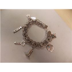 BRACELET- STERLING SILVER WITH 6 STERLING SILVER CHARMS