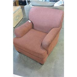 UPOLSTERED DESIGNER RUST COLORED ARMCHAIR