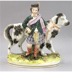 GOOD STAFFORDSHIRE POTTERY GROUP, English. 19th Century. Of a Scottish lad standing next to his...