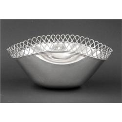 CARTIER STERLING SILVER BOWL, Italian. Of deep oval form with pinched sides, enclosed by a pier...