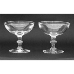 SET OF TWELVE STEUBEN CRYSTAL SAUCER CHAMPAGNE, American. Signed. With knop stem. $500/700...