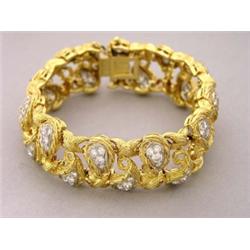 VERY FINE TIFFANY & CO. DIAMOND BRACELET, Signed. Composed of leaf shaped links, set with eight...