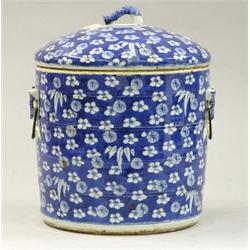 BLUE AND WHITE PORCELAIN JAR AND COVER, Chinese. 19th Century. Of barrel form molded with rings...