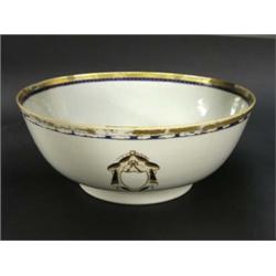 EXPORT PORCELAIN ARMORIAL BOWL, Chinese. Late 18th Century. The interior centered by a shield c...