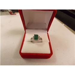 RING - EMERALD FACETED EMERALD & 2 DIAMONDS IN STERLING SILVER SETTING - RETAIL ESTIMATE $350