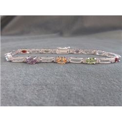 BRACELET - MULTI-GEMSTONE & DIAMOND IN STERLIGN SILVER SETTING - 9 OVAL FACETED GEMS - ESTIMATED RET