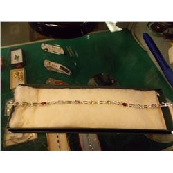 BRACELET - 12 MARQUISE FACETED BLUE TOPAZ & DIAMOND IN STERLING SILVER SETTING - RETAIL ESTIMATE $40