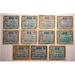 11 Japanese military payments, 2 X one yen, 5 X 10 sen, 4 X 50 sen