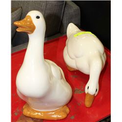 A PAIR OF HANDMADE AND SIGNED CLAY DUCKS
